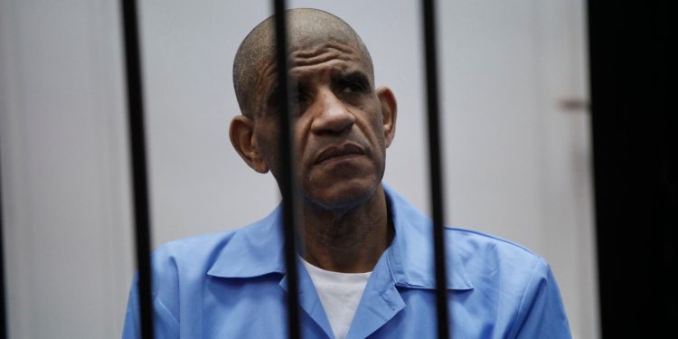 محامي السنوسي لـ أبعاد: تأجيل محاكمة موكلي للمرة الثالثة بسبب انتظار حضور البغدادي المحمودي